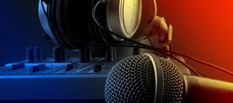 Radio studio broadcasting desk with a microphone and headphones
