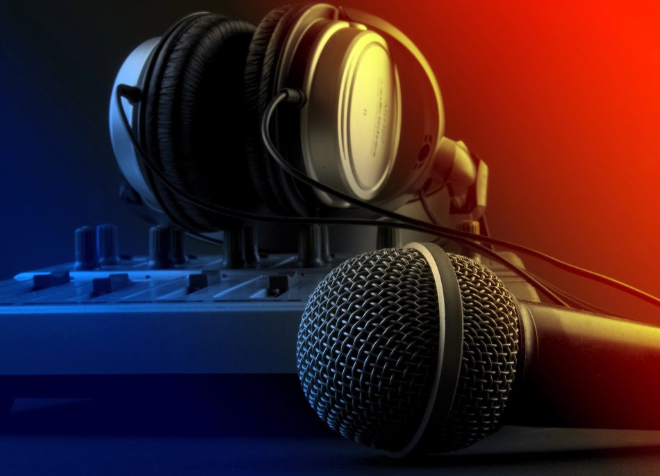Radio studio broadcasting desk with a microphone and headphones